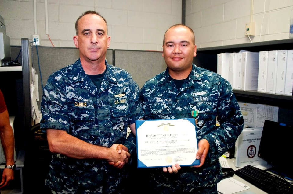 2014 - EM1 (SS) Kirby is awarded Navy and Marine Corps Achievement Medal by CDR Carius