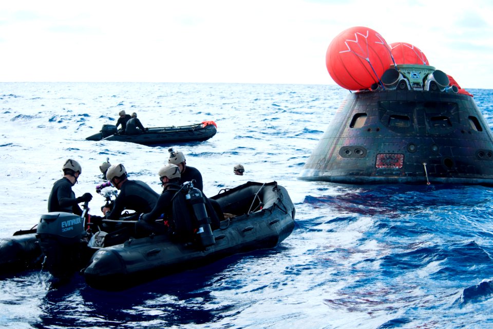 Recovery team arrives at Orion capsule after EFT-1