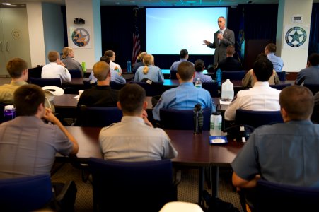 2015 Law Enforcement Explorers Conference group listens to man in suit