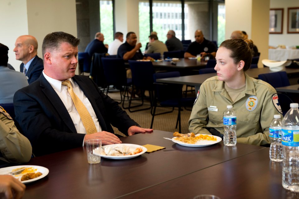 2015 Law Enforcement Explorers Conference man with crew cut speaks to explorer
