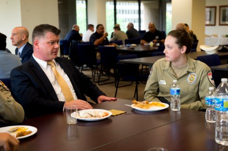 2015 Law Enforcement Explorers Conference man with crew cut speaks to explorer