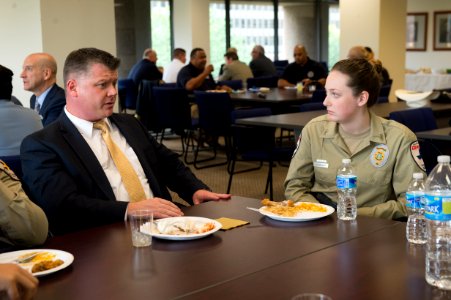 2015 Law Enforcement Explorers Conference man with crew cut speaks to explorer photo