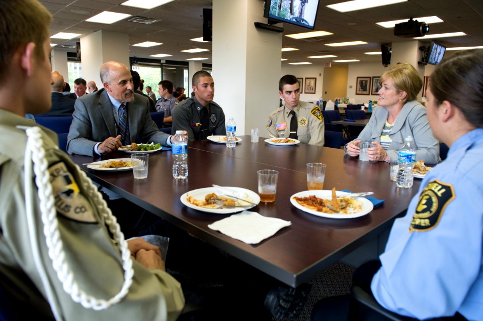 2015 Law Enforcement Explorers Conference various explorers and two adults during lunch