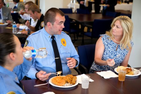 2015 Law Enforcement Explorers Conference an explorer speaks to a woman photo