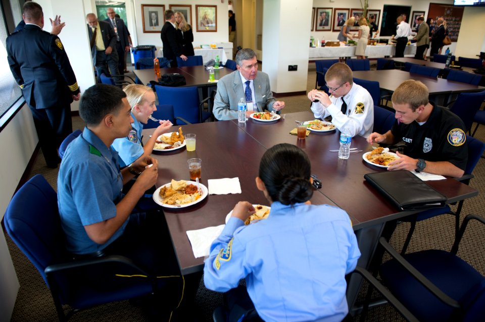 2015 Law Enforcement Explorers Conference five explorers dine with a man