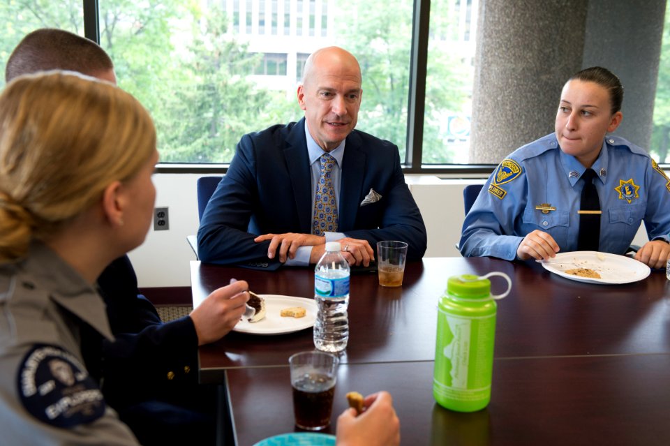 2015 Law Enforcement Explorers Conference three explorers listen to man