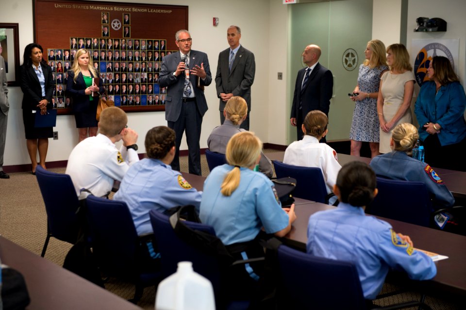 2015 Law Enforcement Explorers Conference man in suit speaks to explorers