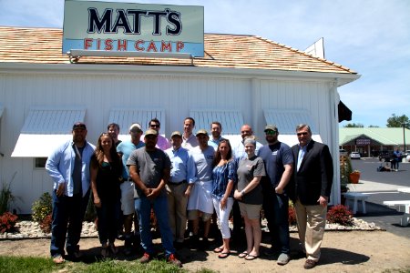 2016-06-16 Senator Coons visits Lewes, DE for the grand opening of Matt's Fish Camp (27433523600)