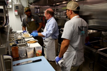 2016-06-16 Senator Coons visits Lewes, DE for the grand opening of Matt's Fish Camp (27433559870)
