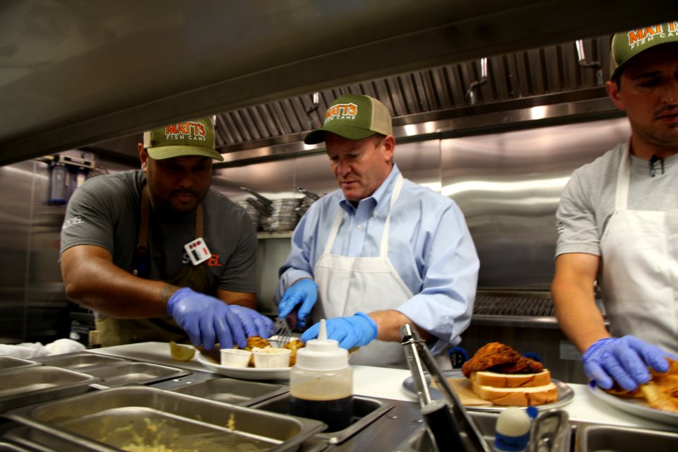 2016-06-16 Senator Coons visits Lewes, DE for the grand opening of Matt's Fish Camp (27711802815)