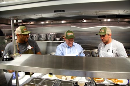 2016-06-16 Senator Coons visits Lewes, DE for the grand opening of Matt's Fish Camp (27433541410)