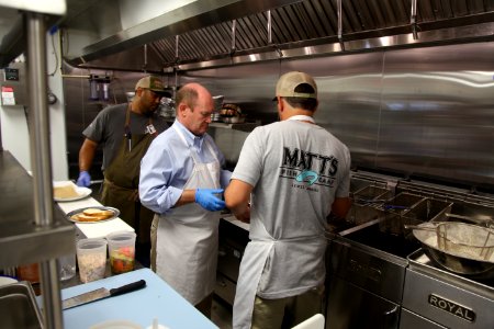 2016-06-16 Senator Coons visits Lewes, DE for the grand opening of Matt's Fish Camp (27433561880)