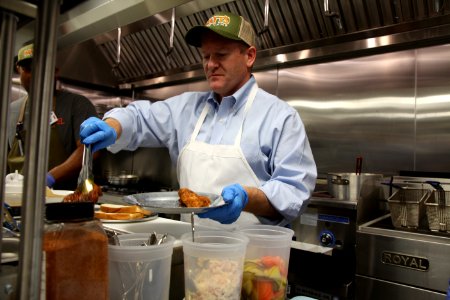 2016-06-16 Senator Coons visits Lewes, DE for the grand opening of Matt's Fish Camp (27677913476)