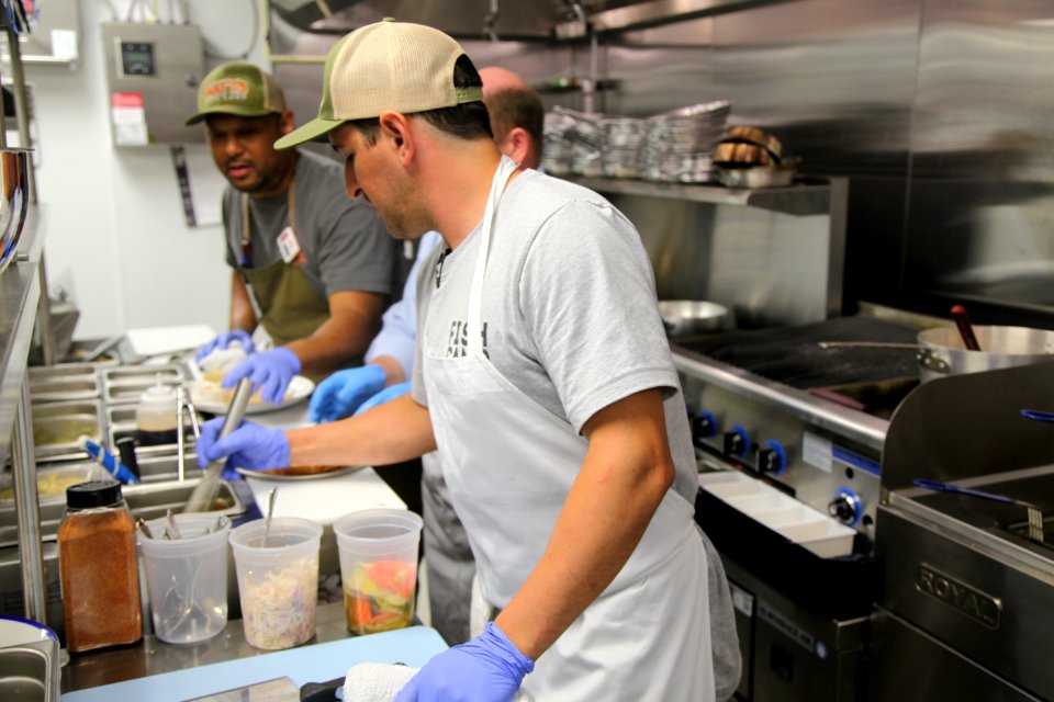 2016-06-16 Senator Coons visits Lewes, DE for the grand opening of Matt's Fish Camp (27637139871)