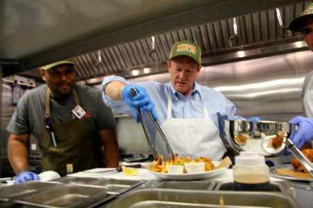 2016-06-16 Senator Coons visits Lewes, DE for the grand opening of Matt's Fish Camp (27711796355)