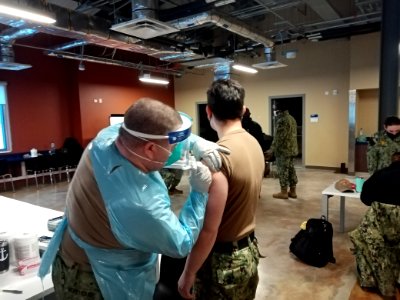210216-N-ZZ999-001 Sailors assigned to Naval Support Facility (NSF) Redzikowo, Poland receive their first dose of the Moderna COVID-19 vaccine