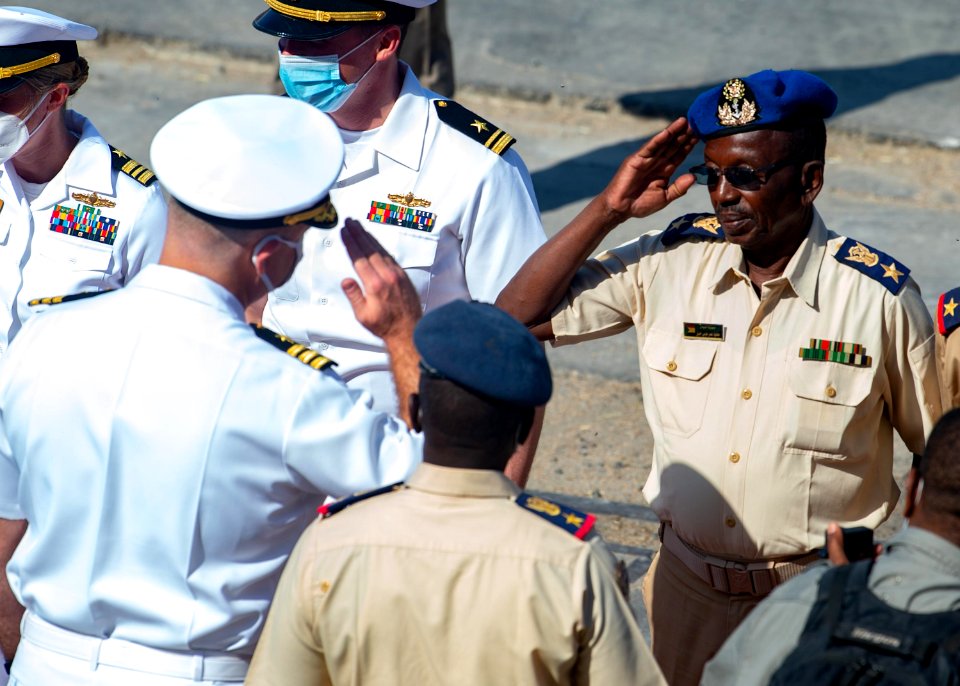 210301-N-PS962-1160 Cmdr. Timothy Shanley greets official party during a scheduled port visit in Port Sudan, Sudan