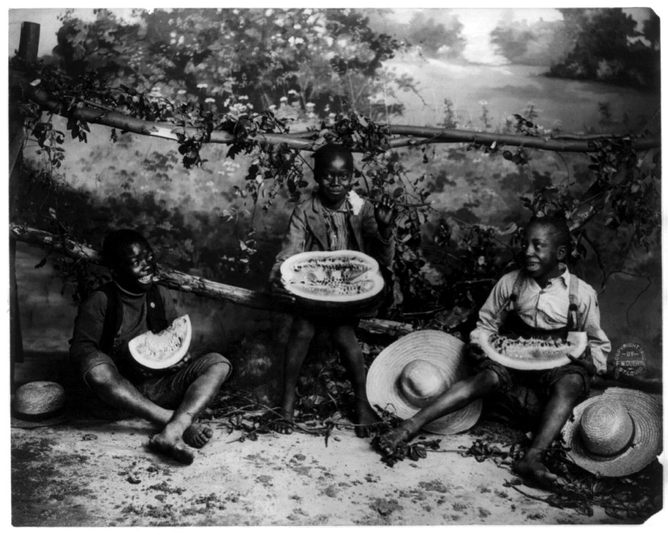 3 African American boys eating watermelon LCCN2004672359