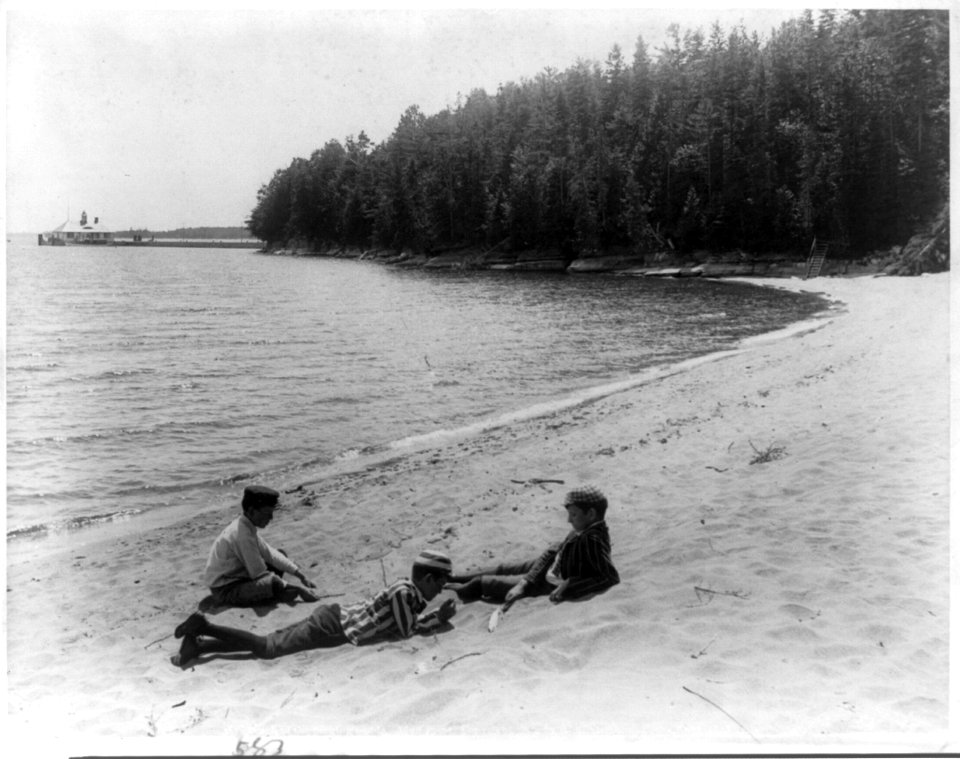 3 boys lounging on beach, Adironacks LCCN2002714418