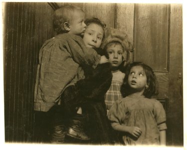 3-30 P.M. Group in tenement hallway. Ages, 14 months, 2, 5, and 7 years. Mother in shop sewing. Father out of work, bartender. Family, Novi, 189 Chrystie Street. LOC nclc.04628