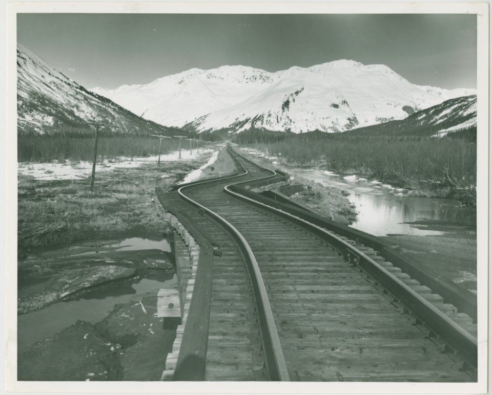 3-64. Earth movement twisted rails near Whittier. Railroad en route to Whittier (32760159593)