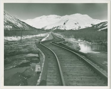 3-64. Earth movement twisted rails near Whittier. Railroad en route to Whittier (32760159593)