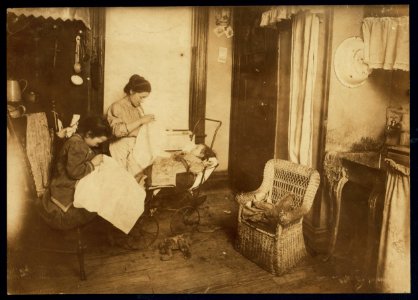 309 W. 146th Street. (...) and her seven year old daughter, Lorenza, embroidering ladies waists in their dirty kitchen-living room. Lorenza makes the stems of the flowers. Her mother said, LOC nclc.05487