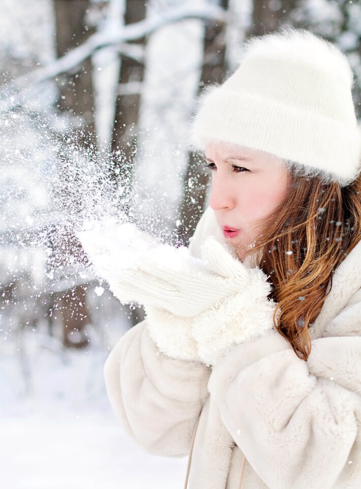 Christmas frost woman blowing snow