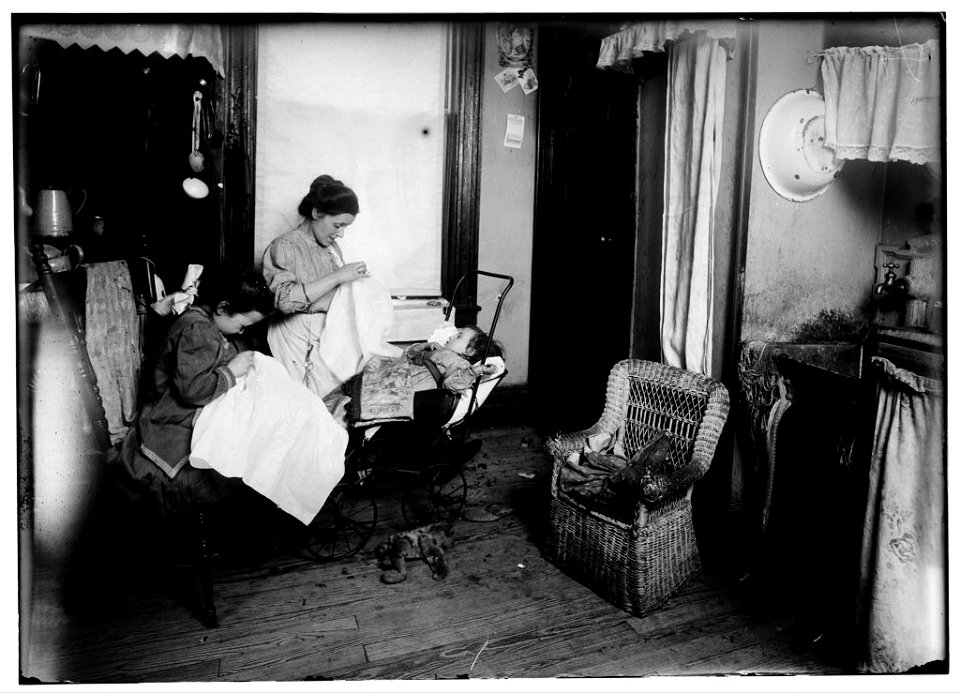 309 W. 146th Street. (...) and her seven year old daughter, Lorenza, embroidering ladies waists in their dirty kitchen-living room. Lorenza makes the stems of the flowers. Her mother said, LOC nclc.05487