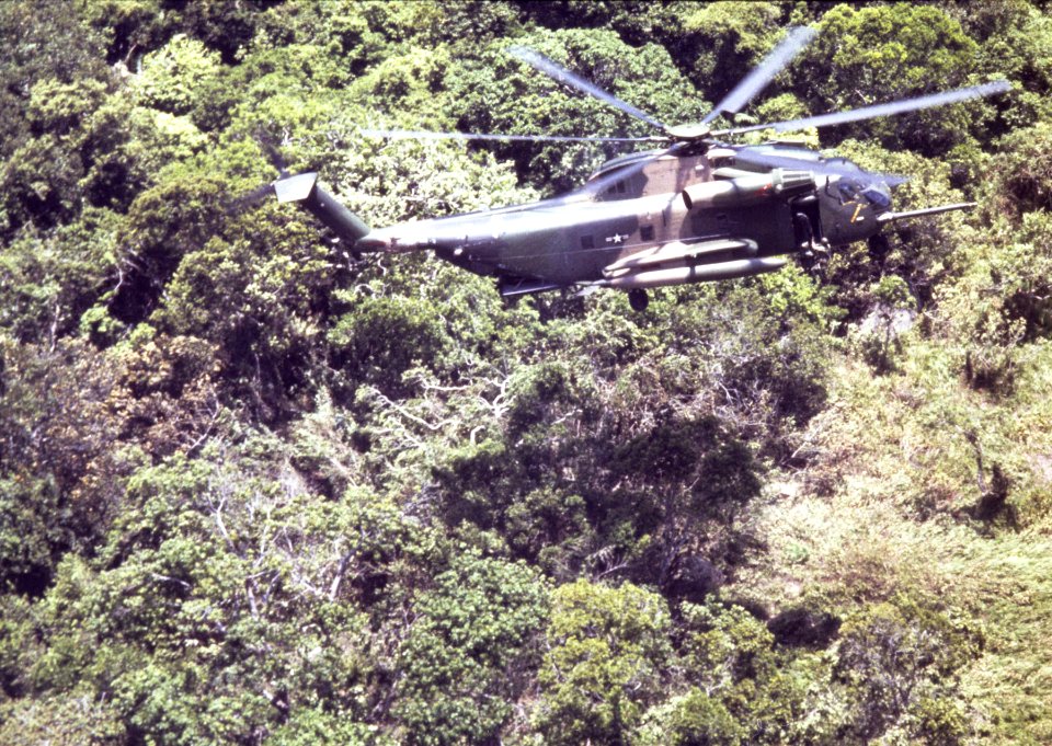 37th ARRS HH-53 lowers pararescueman