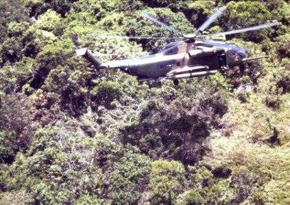 37th ARRS HH-53 lowers pararescueman