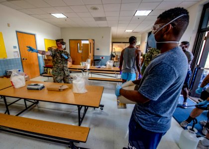 3rd Medical Battalion Corpsman sanitize facility for USS Theodore Roosevelt Sailors (49774743292)