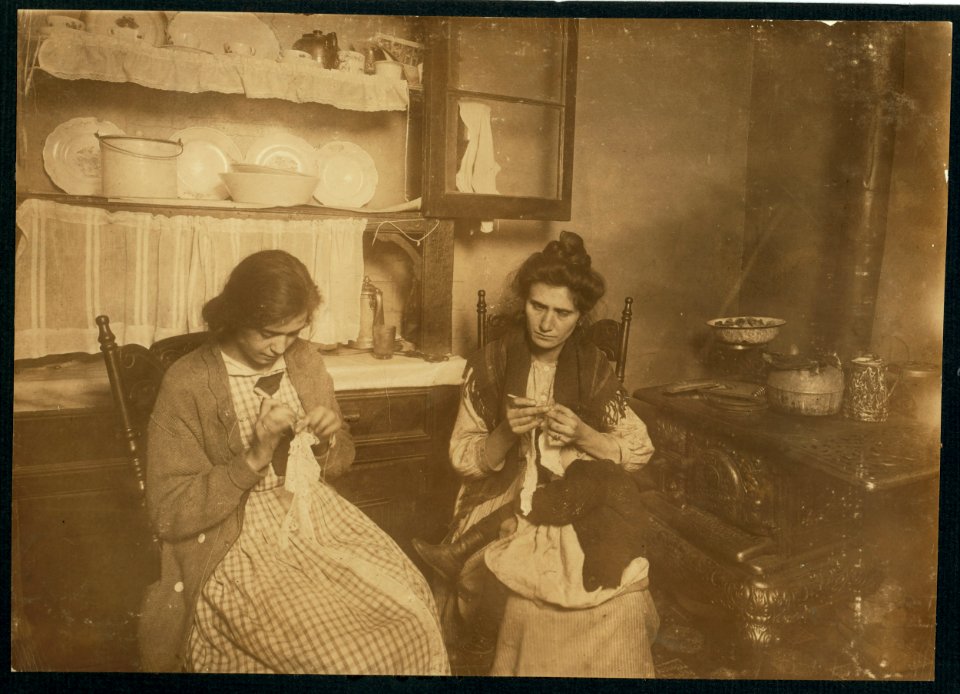 4-00 P.M. Making lace collars at home (usually in kitchen). Mrs. Vencique, 309 E. 110th St., working with baby asleep in lap. Her sister, Tessie Amendola, 15 years old, works all the time. LOC cph.3b22403