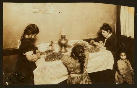4-30 P.M. Mrs. Annie De Maritius, 46 Laight St., front, Nursing a dirty baby while she picks nuts. Was suffering with a sore throat. Rosie, 3 yrs. old hanging around. Conevieve, 6 yrs. old. LOC cph.3b36704