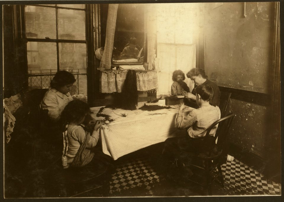 5 P.M. Mrs. Mary Molinari and family, 304 E. 107th St. 'We made feathers some, but not much.' Six-year-old Antoinette ties like an old hand. Dominick, 9 years old, works some. Annie 9, the LOC nclc.04122