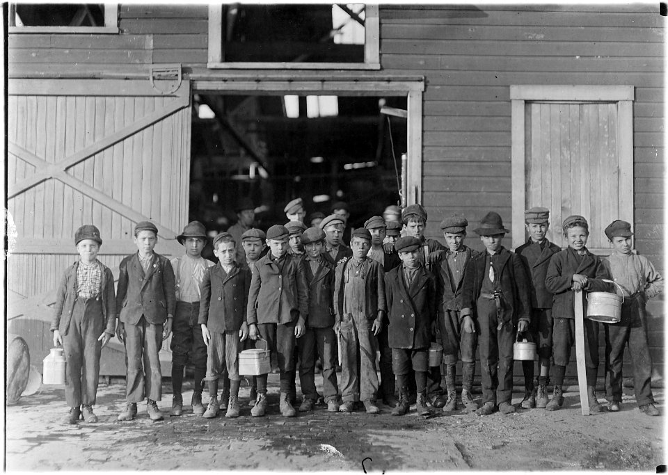 5 pm. Boys going home from Monougal Glass Works. A native remark, De place is lousey wid kids. Fairmont, W. Va. - NARA - 523094