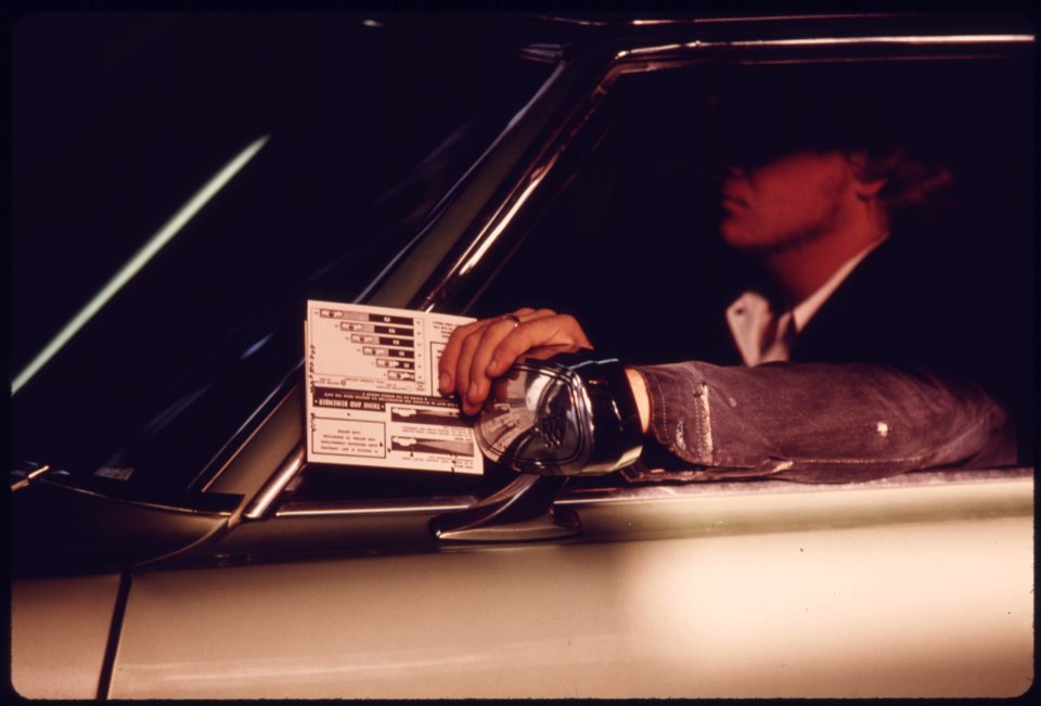 5Driver Holding His Car's Test Card as It Proceeds Along the Safety Lane During a Checkup at an Auto Emission Inspection Station in Downtown Cincinnati, Ohio...09-1975 (4266534392)