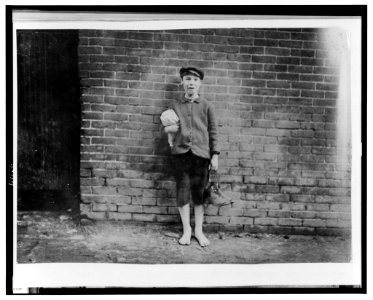 6 P.M. April 23, 1909. A sweeper in the Hill Mfg. Co., Lewiston, Me. I saw him working inside. LOC cph.3c27562