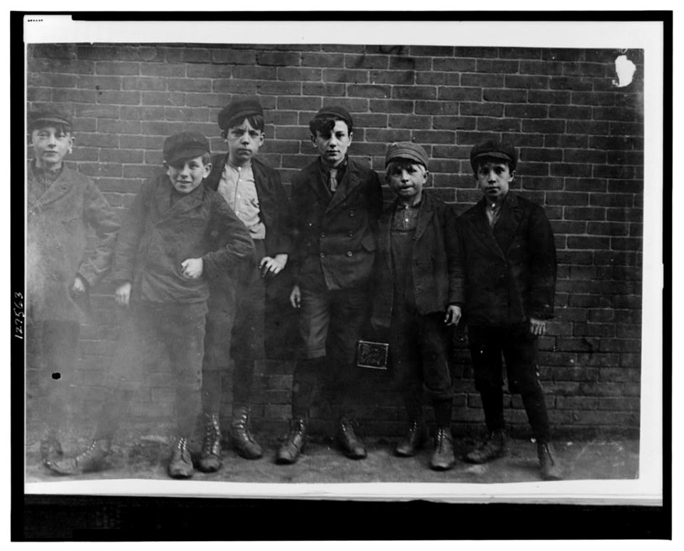 6 P.M. April 23, 1909. Sweepers, etc., in Hill and Bates Mills. Lewiston, Me. Boy next to right hand end is Jo. Been in Hill Mill 2 years (see photo 709). Only one or two could speak LOC cph.3c27563
