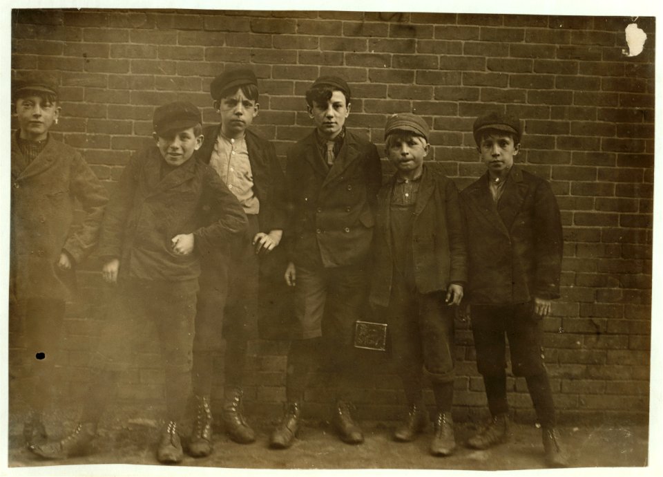6 P.M. April 23, 1909. Sweepers, etc., in Hill and Bates Mills. Lewiston, Me. Boy next to right hand end is Jo. Been in Hill Mill 2 years (see photo 709). Only one or two could speak LOC cph.3c27563
