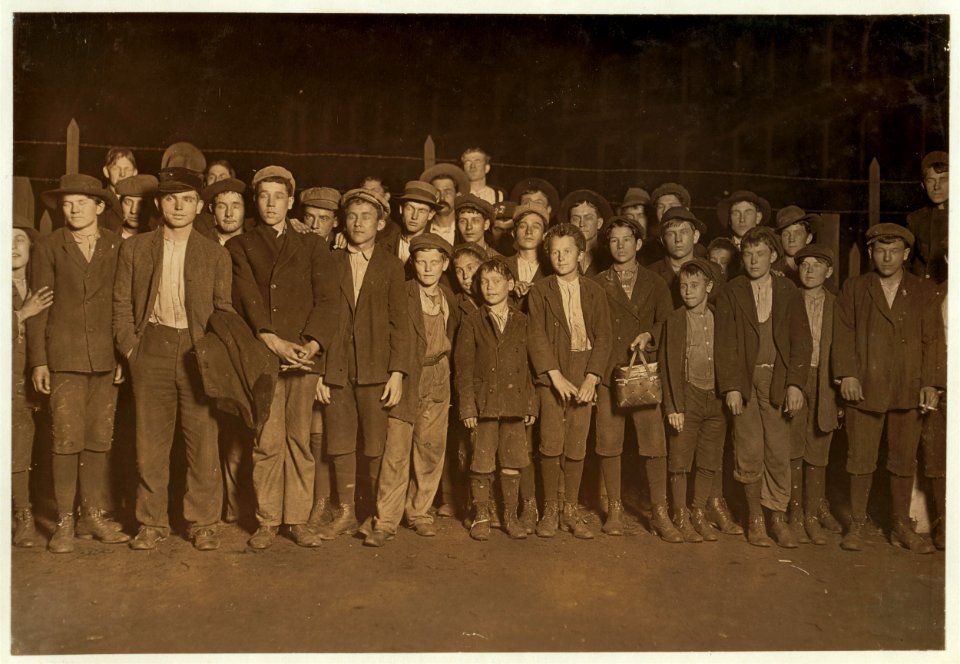 6-00 P.M. Flashlight photo of part of force going home. Sibley Mfg. Co. Augusta, Ga. Some of the smallest boys said been in mill from one to several yrs. Jan. 15, 1909. LOC nclc.01644