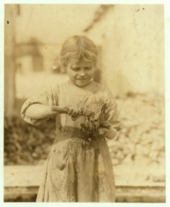 7 year old oyster shucker. Speaks no English. Father and mother earn about $15 a week, and this little one works steady and her six year old brother same. Lowden Canning Co. LOC nclc.01020
