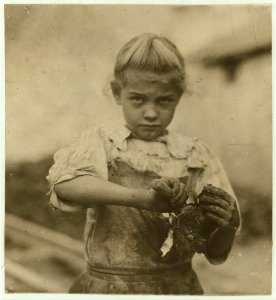 7-year old Rosie. Regular oyster shucker. Her second year at it. Illiterate. Works all day. Shucks only a few pots a day. (Showing process) Varn & Platt Canning Co. LOC nclc.01014