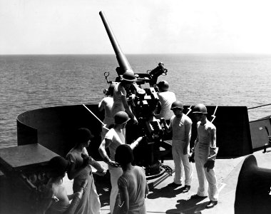 76mm gun crew aboard USS Charger (AVG-30), in June 1942 (NH 106856)