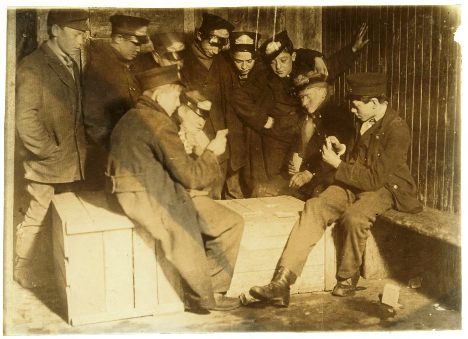 8-00 P.M. Flashlight photo of messengers absorbed in their usual Poker game in the 'Den of the Terrible Nine' (the waiting room for Wes. Union Messengers, Hartford, Conn.) They play for LOC cph.3c21885