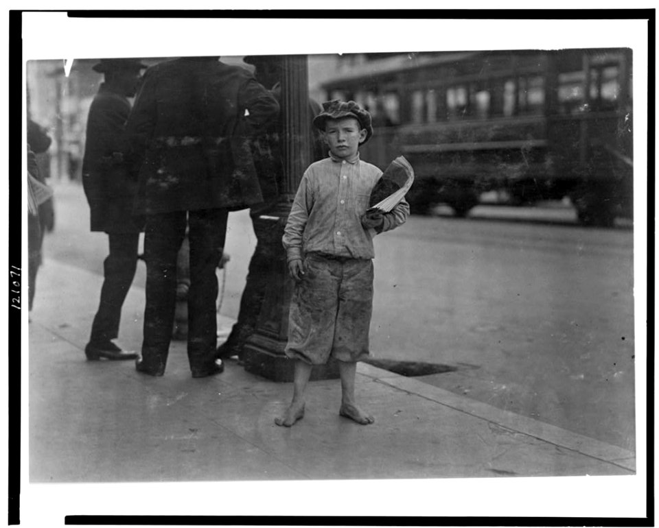 9 year old newsboy selling near Southern Pacific Depot. A negro bystander said- 'He's de boss fighter of 5th Street.' See California report. LOC cph.3c21071
