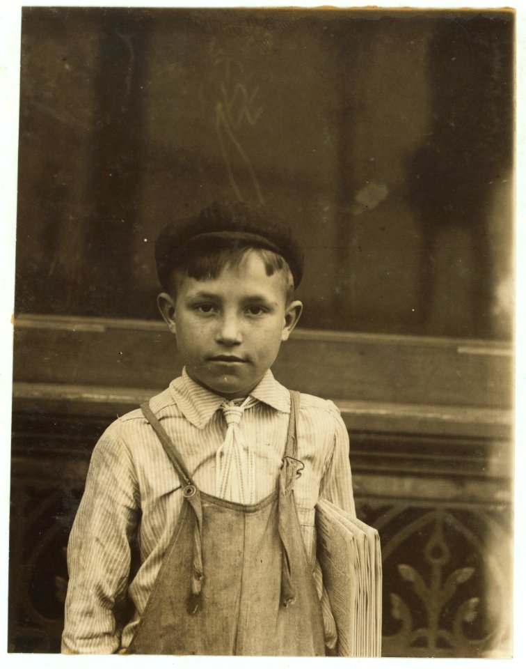 9 year old boy who was smoking and playing pool in Pool Room Branch (Chouteau & Manchester) while waiting for papers. 4 P.M. May 5, 1910. LOC nclc.03459