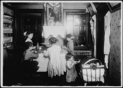 A reflection on the parent. Reflection in looking glass shows the father who has been picking nuts but refused to... - NARA - 523493