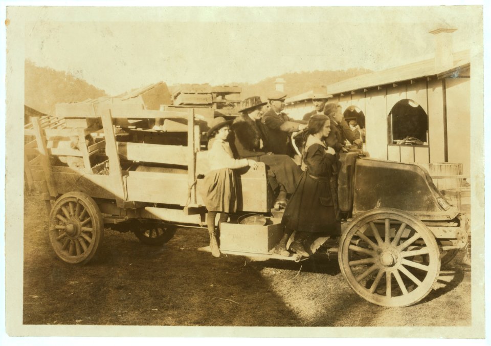 A 4 H family bringing in their exhibits (pig, sheep, poultry) to the annual 4 H Fair at Charleston, W. Va. LOC nclc.04390