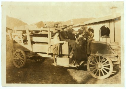 A 4 H family bringing in their exhibits (pig, sheep, poultry) to the annual 4 H Fair at Charleston, W. Va. LOC nclc.04390